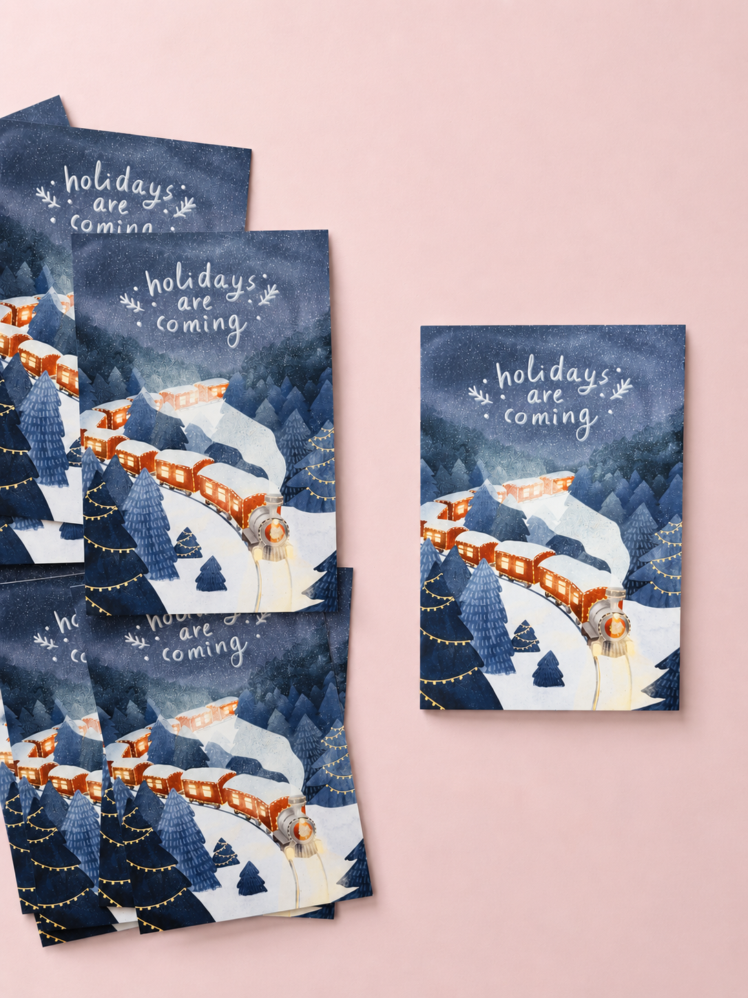 Christmas greeting card with a red train travelling through a snowy winter forest under a dark blue starry sky, featuring the text “Holidays are coming”.