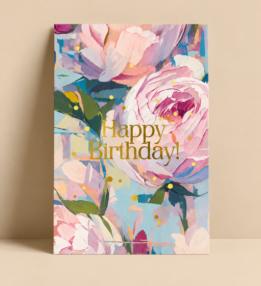 Greeting card illustrated with a painterly pink and blue peony scene and "Happy Birthday!" lettering in gold foil.