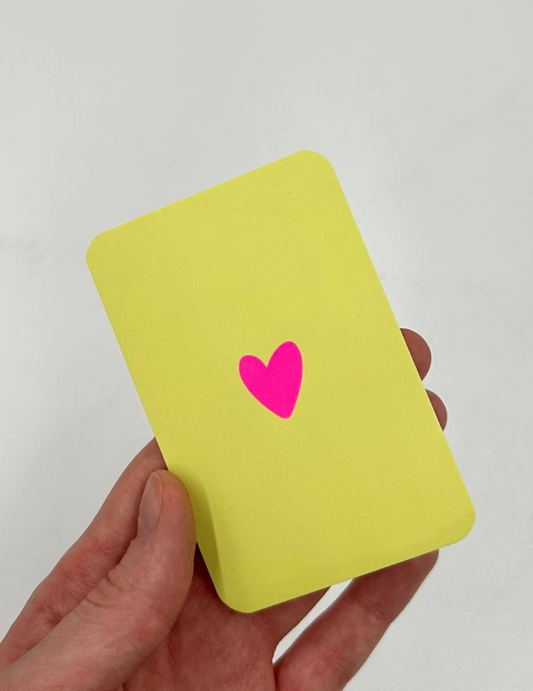 Mini apple green greeting card with a single bright pink heart in the center.
