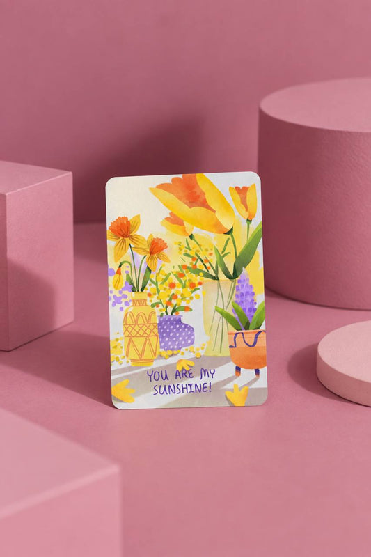 Mini greeting card illustrated with yellow, orange, and purple flowers in patterned vases, with "You Are My Sunshine!" hand-lettered text.